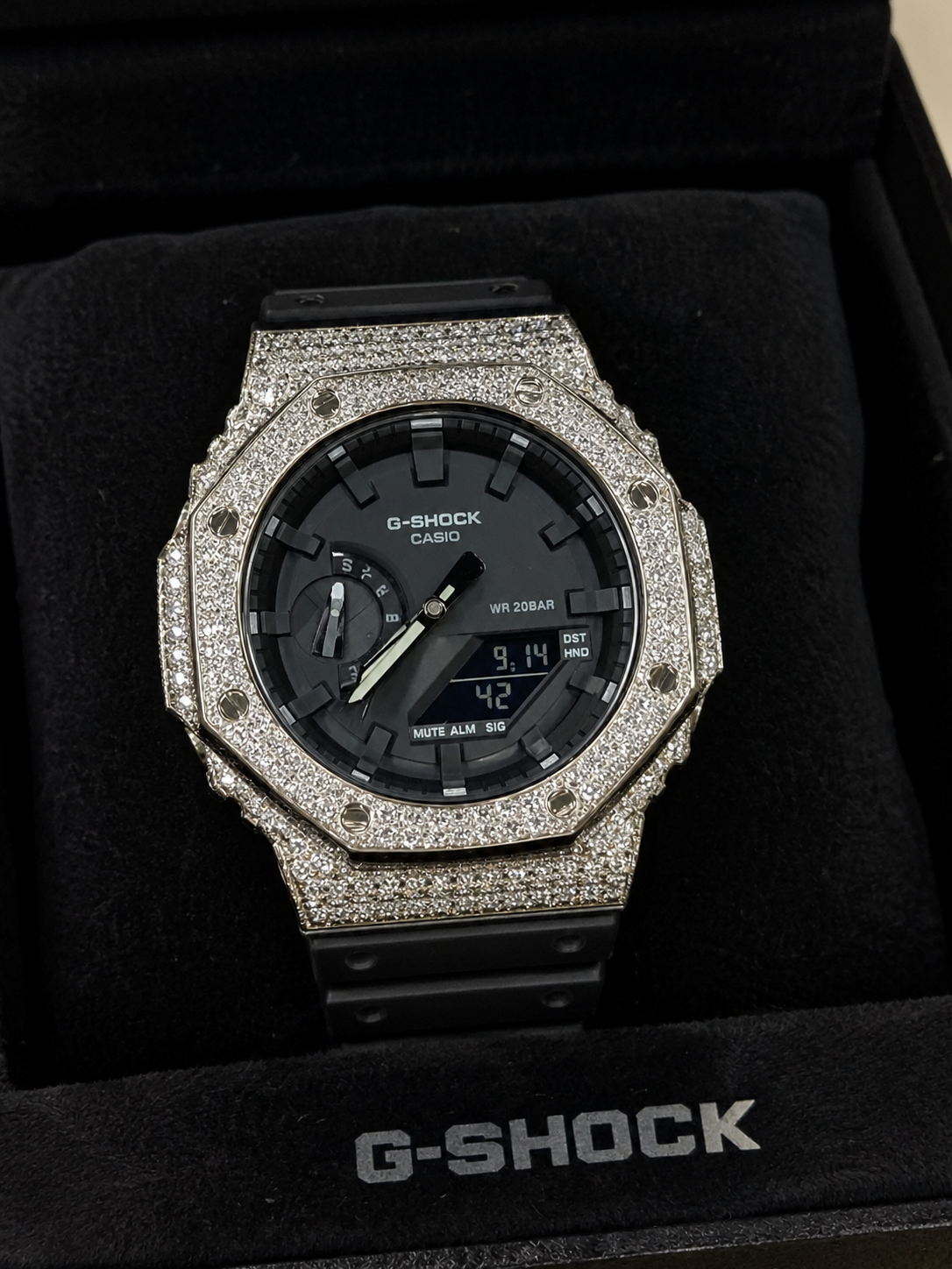 Black G-Shock with an iced-out silver bezel